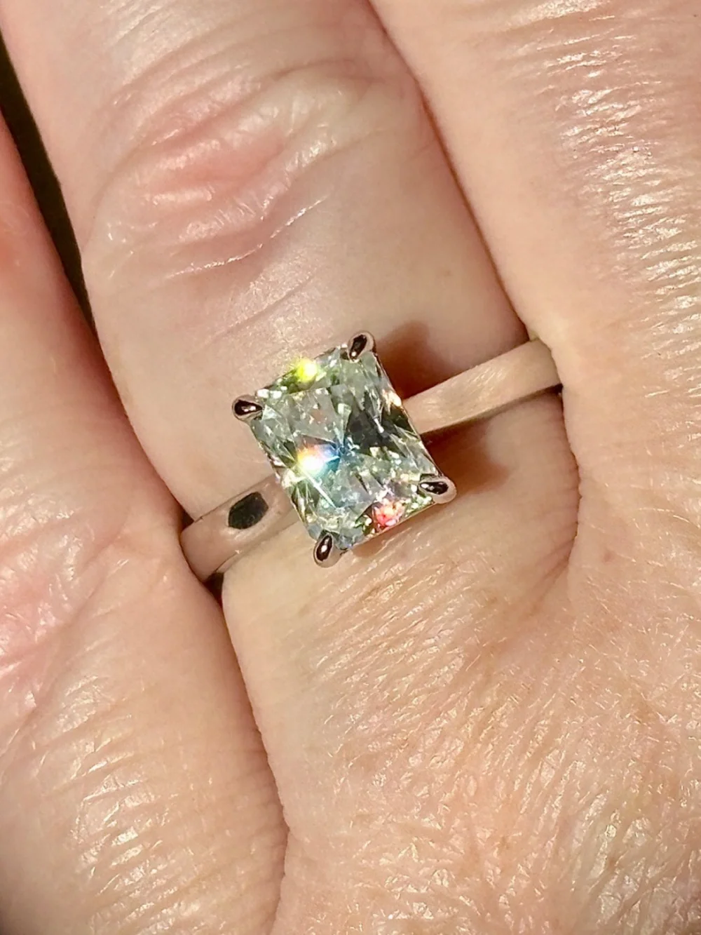 A certified 3ct radiant Moissanite solitaire in solid sterling silver and 18k!